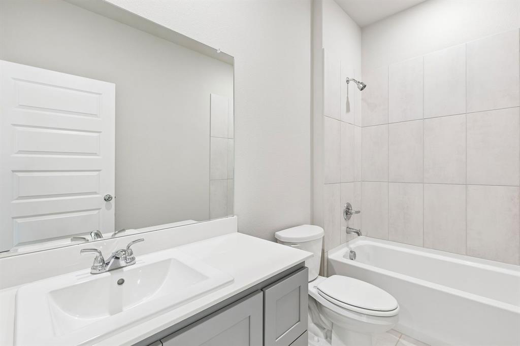 1156 Del Rio Drive Lavon, TX 75166 - Photo 32 of 35 a bathroom with a sink toilet and shower