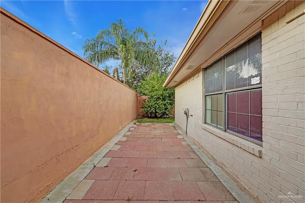 2401 South Jackson Road, Unit 29 Pharr, TX 78577 - Photo 16 of 20 a view of a pathway both side of house