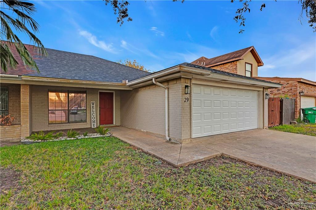 2401 South Jackson Road, Unit 29 Pharr, TX 78577 - Photo 2 of 20 a front view of a house with garden