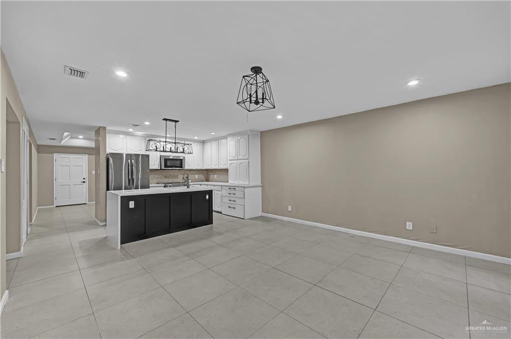 2401 South Jackson Road, Unit 29 Pharr, TX 78577 - Photo 8 of 20 a large kitchen with a cabinets and counter space
