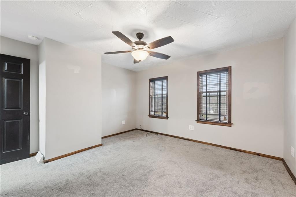 330 Braeburn Road Lower Burrell, PA 15068 - Photo 18 of 31 an empty room with windows and fan