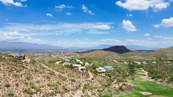 a view of a lake with a yard