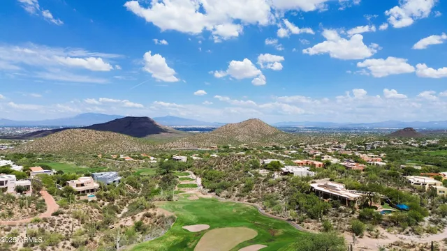 a view of a city with lush green forest