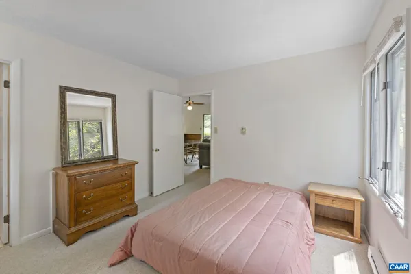 a bedroom with a bed and a dresser