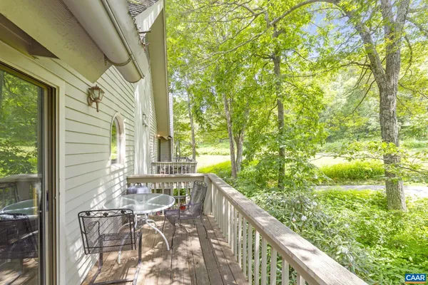 a view of balcony with furniture