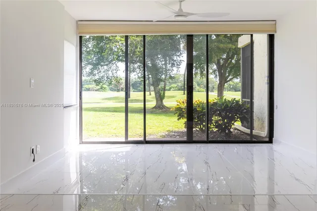 a living room with furniture large window with outer view