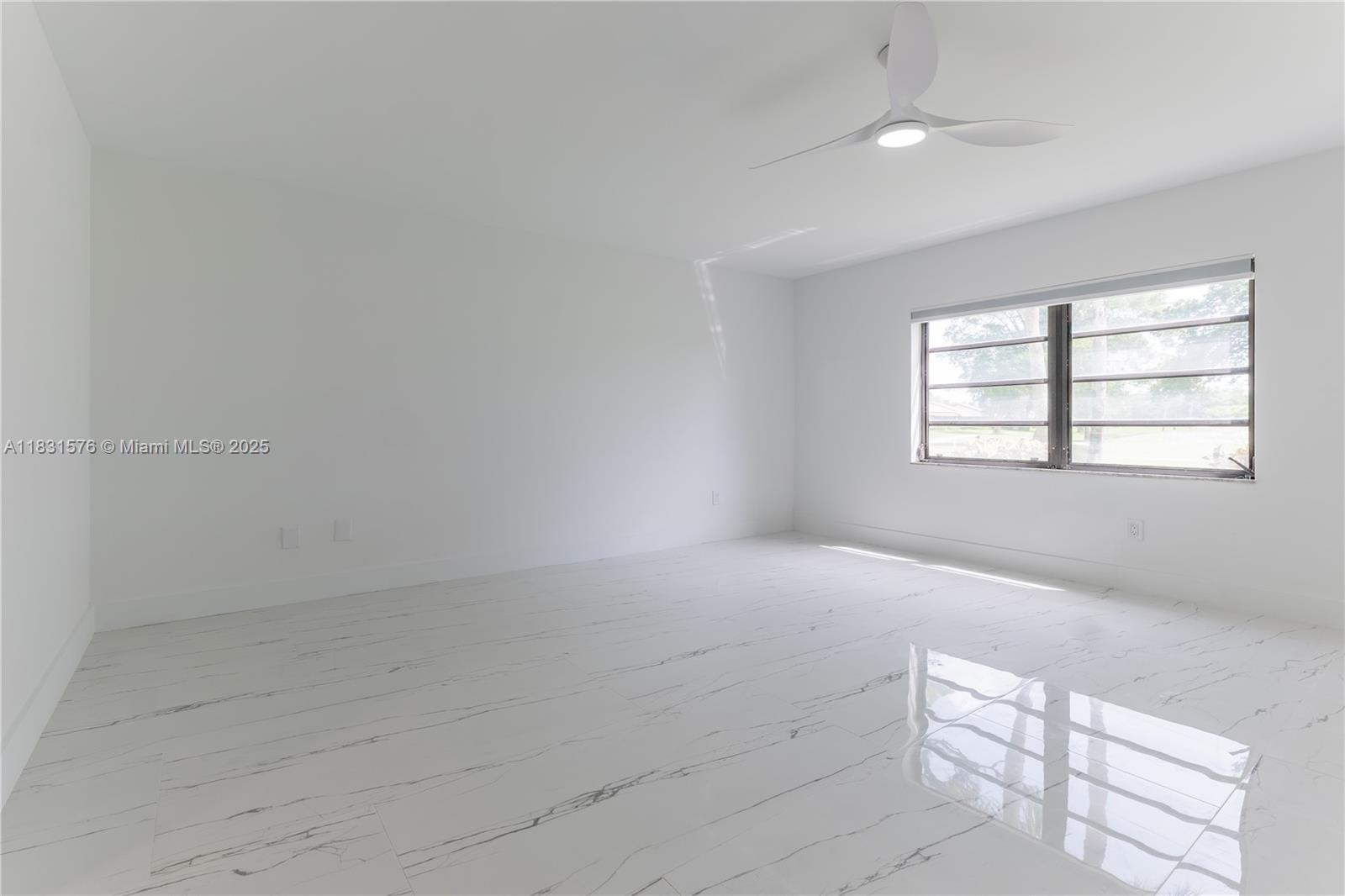 8435 Casa Del Lago, Unit 22C Boca Raton, FL 33433 - Photo 24 of 55 an empty room with windows