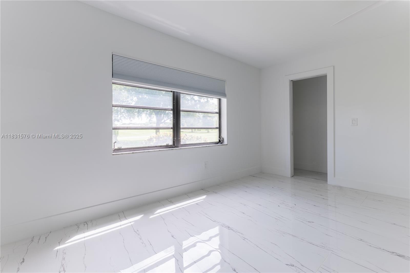 8435 Casa Del Lago, Unit 22C Boca Raton, FL 33433 - Photo 30 of 55 a view of an empty room with a window