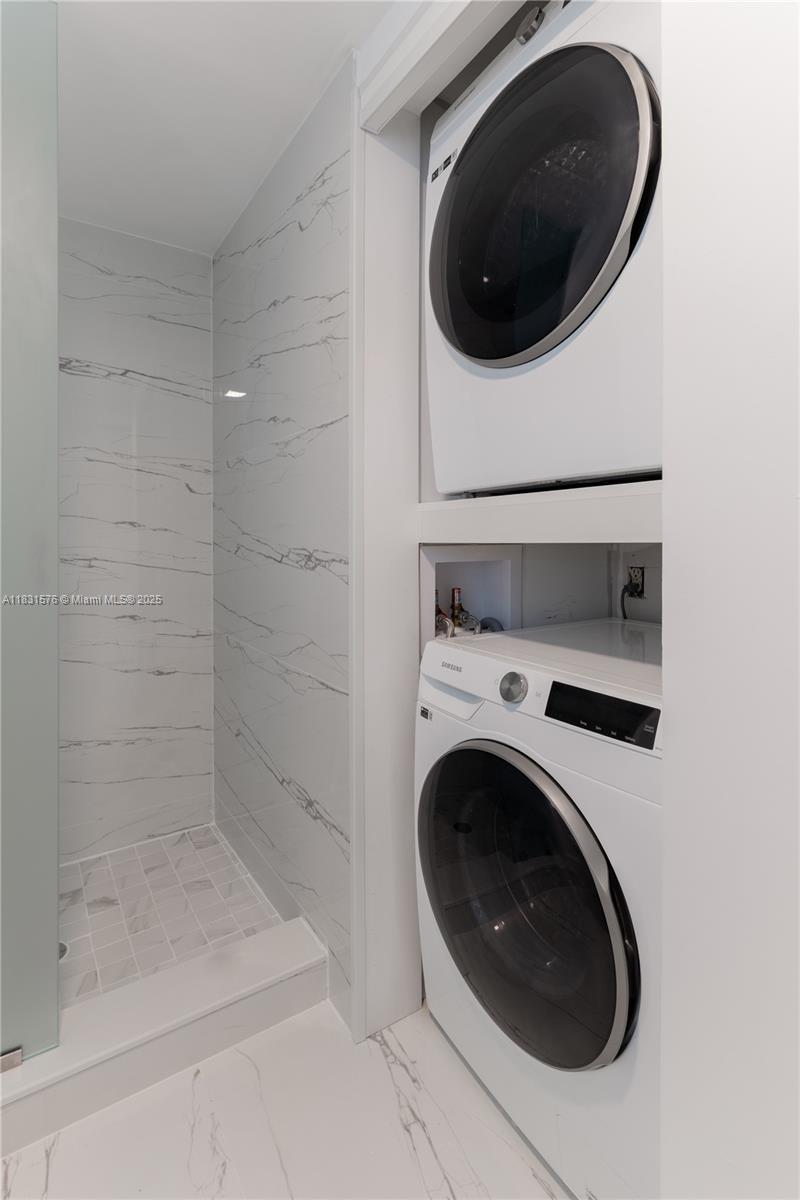 8435 Casa Del Lago, Unit 22C Boca Raton, FL 33433 - Photo 35 of 55 a utility room with dryer and washer