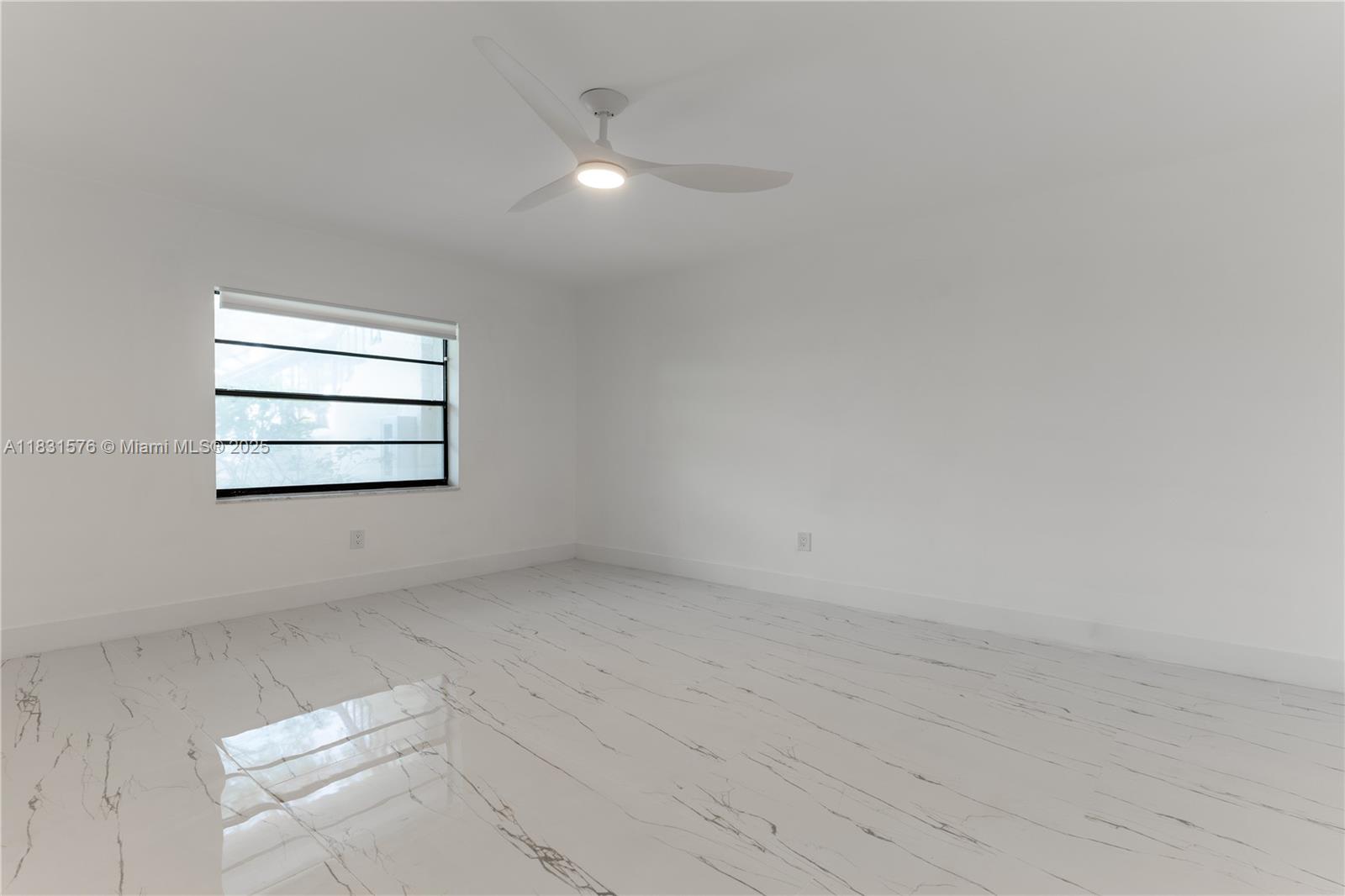 8435 Casa Del Lago, Unit 22C Boca Raton, FL 33433 - Photo 38 of 55 an empty room with windows