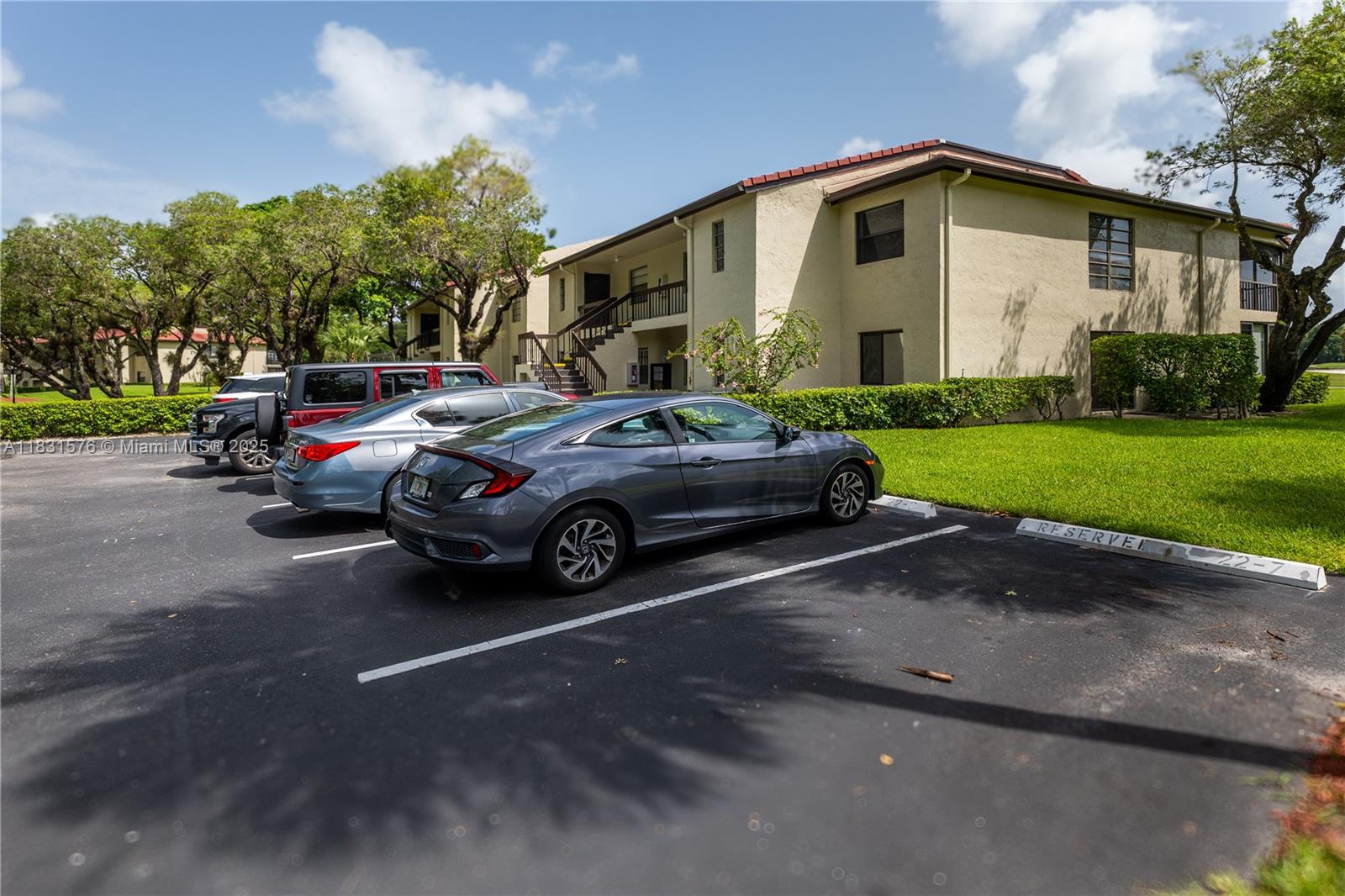 8435 Casa Del Lago, Unit 22C Boca Raton, FL 33433 - Photo 45 of 55 a view of a car parked in front of a house
