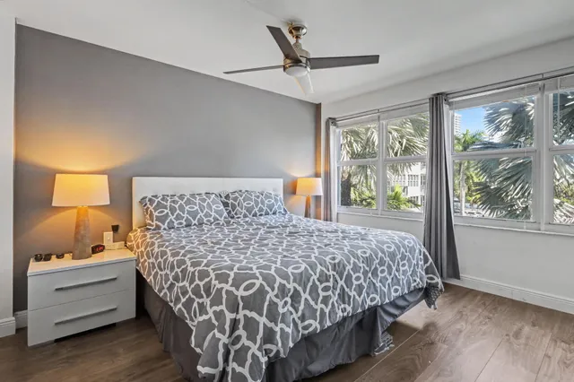 a bedroom with a bed and a television