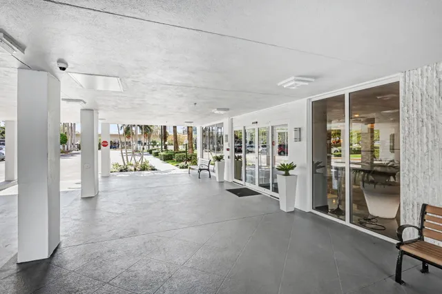 a view of a hallway with wooden shelves