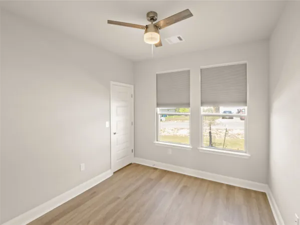a view of a hallway with a white walls