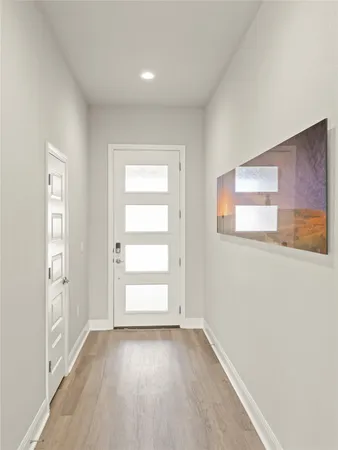 an empty room with windows and closet