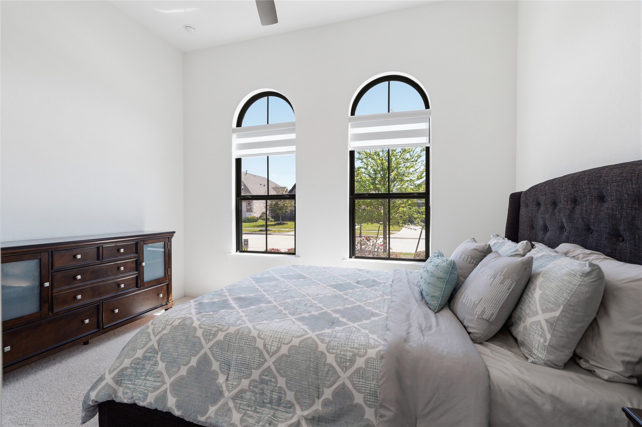 416 Bartlett Street Webster, TX 77598 - Photo 35 of 49 Bedroom 3 alternate view showing arched windows and dresser