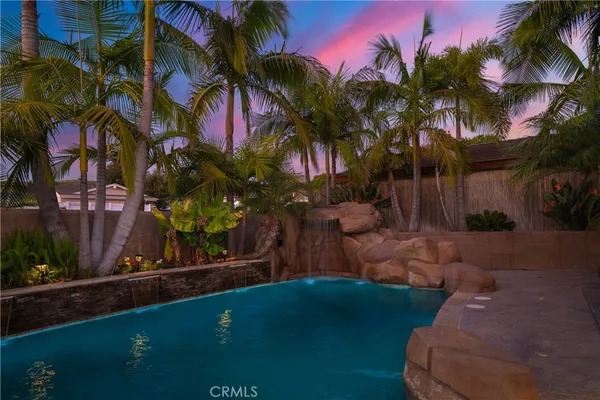 a kitchen with stainless steel appliances a sink and a refrigerator
