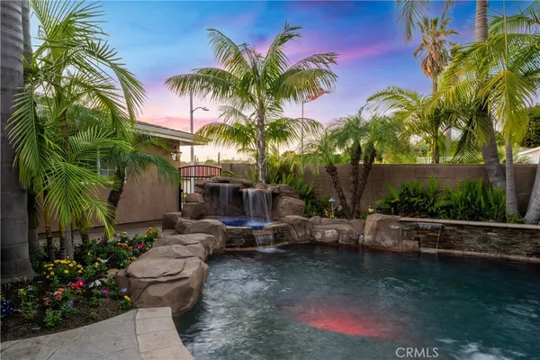 a kitchen with stainless steel appliances granite countertop a sink and stove top oven