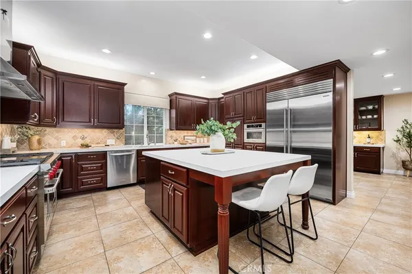 a bath tub sitting in a bathroom next to a window