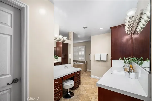 a bath tub sitting in a bathroom next to a window