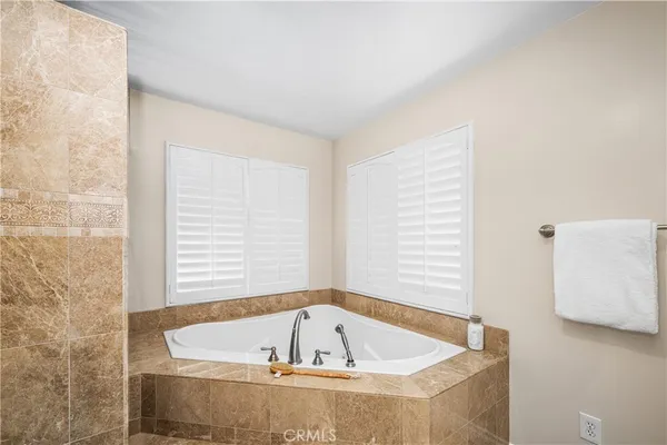 a view of staircase with railing and a potted plant