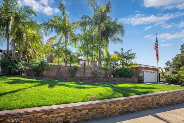 a view of a house with a garden