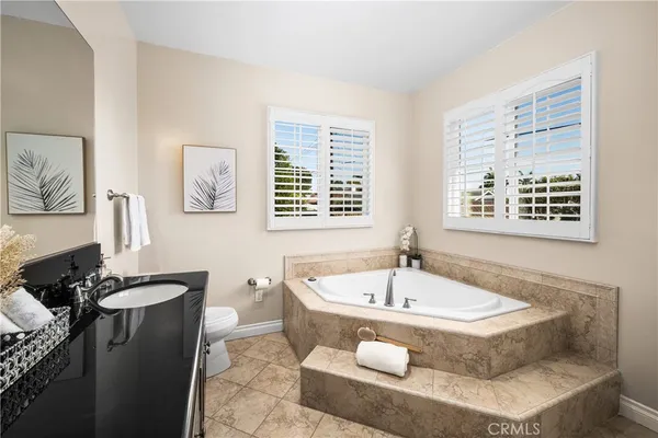 an aerial view of residential houses with city view