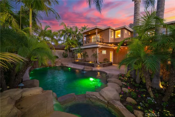 a view of swimming pool with a table and chairs