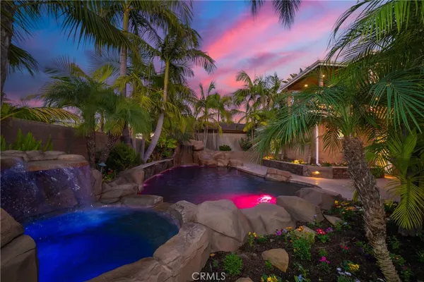 a view of a patio with table and chairs and potted plants