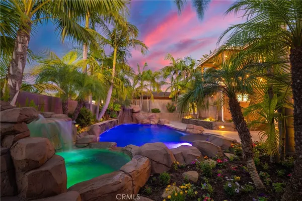 a view of a patio with table and chairs potted plants