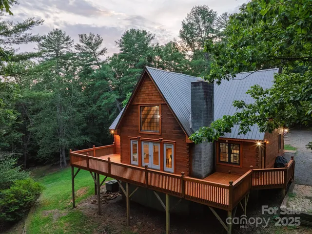 a house view with a sitting space and garden