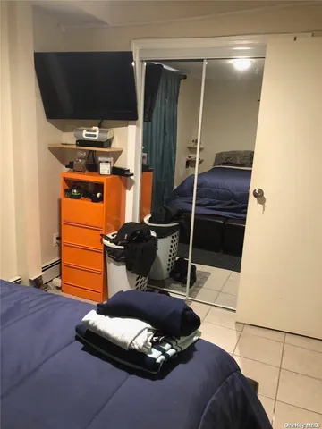 a room with a chair and storage