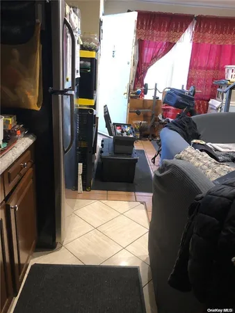 a bed room with a bed and a television