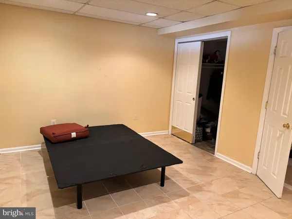 a bedroom with a bed and cabinets