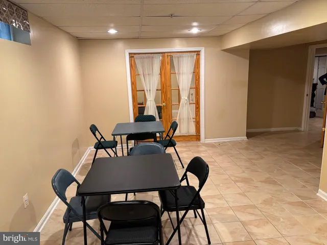 a view of a dining room with furniture and a window