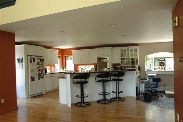 67 Powers Mill Road Phillipston, MA 01331 - Photo 4 of 8 a view of a kitchen with dining table and chairs