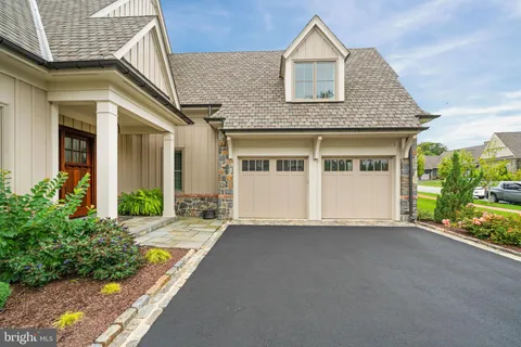 a building outdoor space with patio furniture and garden