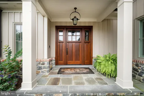 a view of a patio with table and chairs