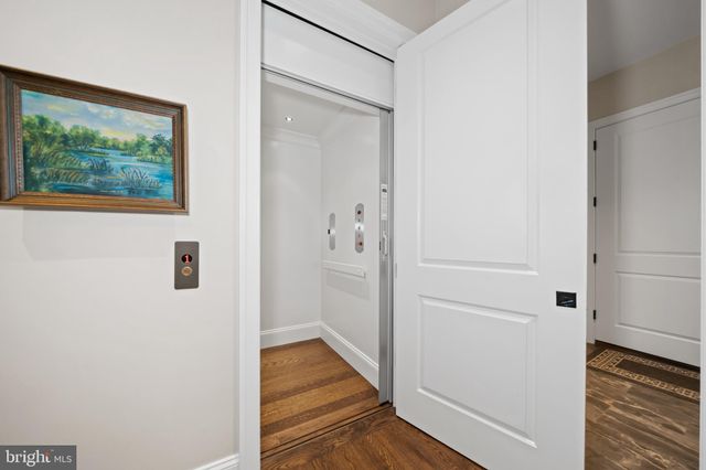 a bathroom with a granite countertop sink toilet and a mirror