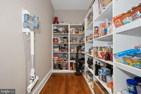 a view of a room with a wooden floor