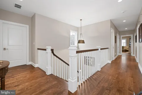 a living room with furniture flat screen tv and a table