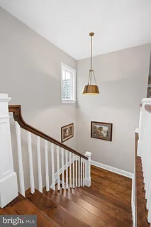 a view of a livingroom with workspace and a window