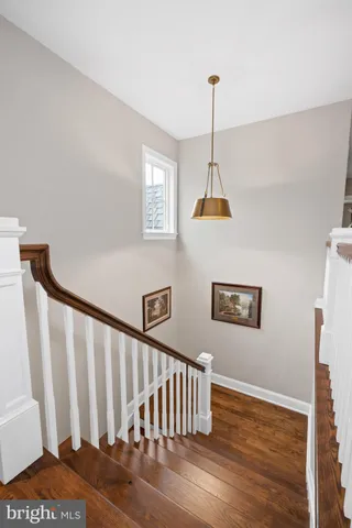 a view of a livingroom with workspace and a window