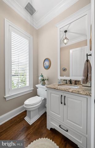 a spacious bedroom with a bed and a chandelier