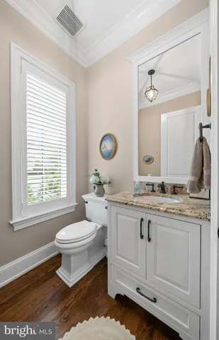 a spacious bedroom with a bed and a chandelier