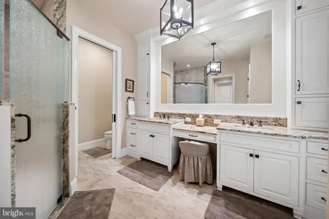 a large kitchen with lots of counter space and stainless steel appliances