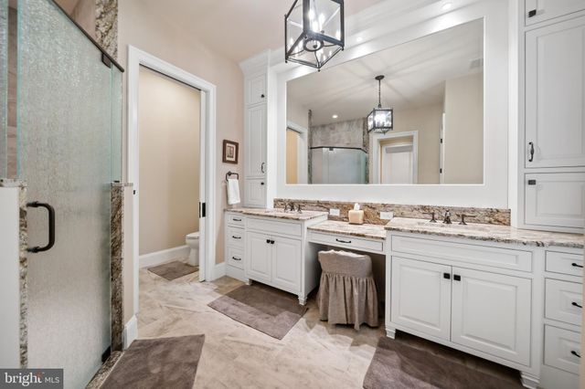 a large kitchen with lots of counter space and stainless steel appliances