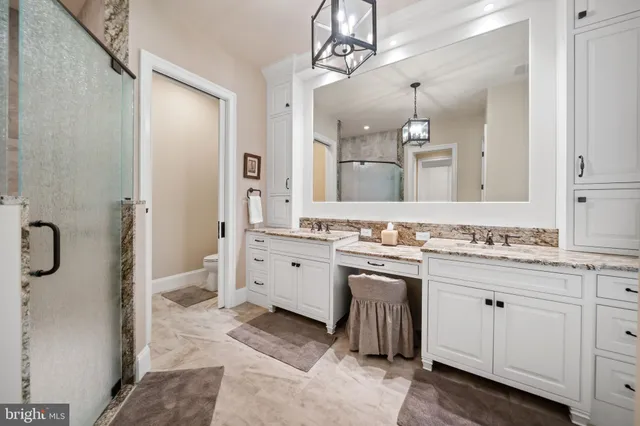 a large kitchen with lots of counter space and stainless steel appliances