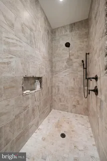 a living room with fireplace furniture and a flat screen tv