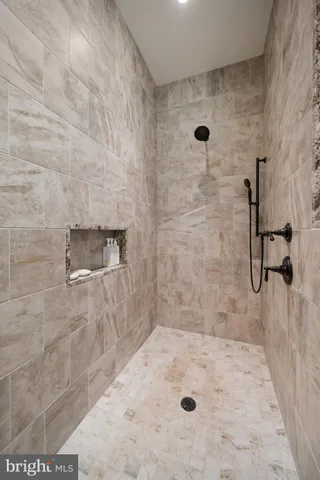 a living room with fireplace furniture and a flat screen tv